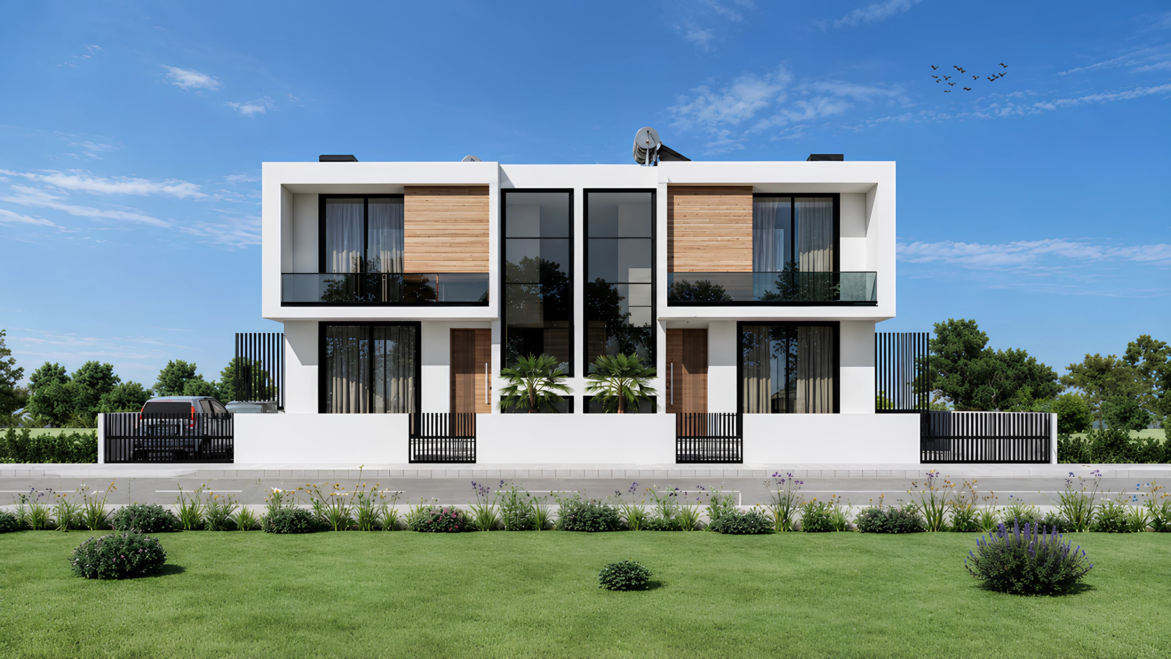 Contemporary twin villas framed by a blue Cyprus sky